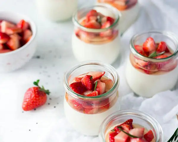 Yogurt parfait layered with fresh strawberries and honey for a simple breakfast or snack